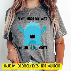May include: Gray t-shirt with a blue monster graphic and the text "'EYE' MADE MY WAY TO THE 100TH DAY!"  (GLUE ON 100 GOOGLY EYES - NOT INCLUDED)