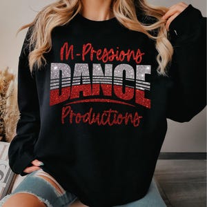 May include: Black sweatshirt with red glitter text that reads "M-Pressions Dance Productions".
