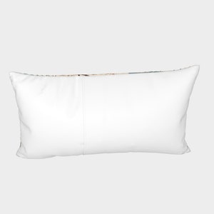 May include: A white rectangular pillow with a zipper closure. The pillow is lying flat on a light gray background.