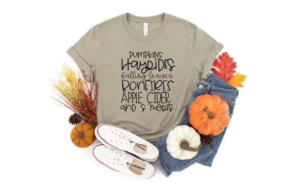 Pumpkins Hayrides Falling Leaves Bonfires Apple Cider And Smores Fall Tshirt,Fall Word Shirt,Fall Is Here Tee,I Love Fall Most Of All Top