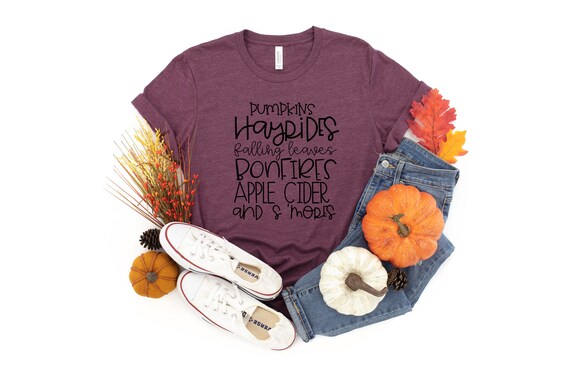 Pumpkins Hayrides Falling Leaves Bonfires Apple Cider And Smores Fall Tshirt,Fall Word Shirt,Fall Is Here Tee,I Love Fall Most Of All Top