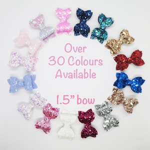 May include: A variety of 1.5 inch glitter bows in different colors. Over 30 colors available.