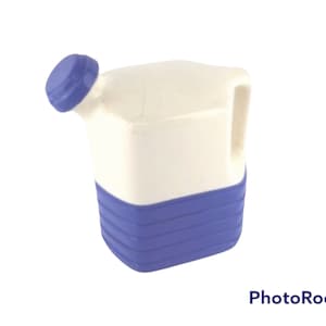 May include: A white plastic watering can with a blue lid and blue base. The can has a handle on the side.