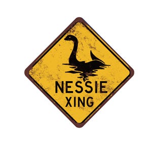 May include: Yellow diamond-shaped warning sign with a black silhouette of the Loch Ness Monster, Nessie, swimming in water. The sign reads "NESSIE XING" in black text.