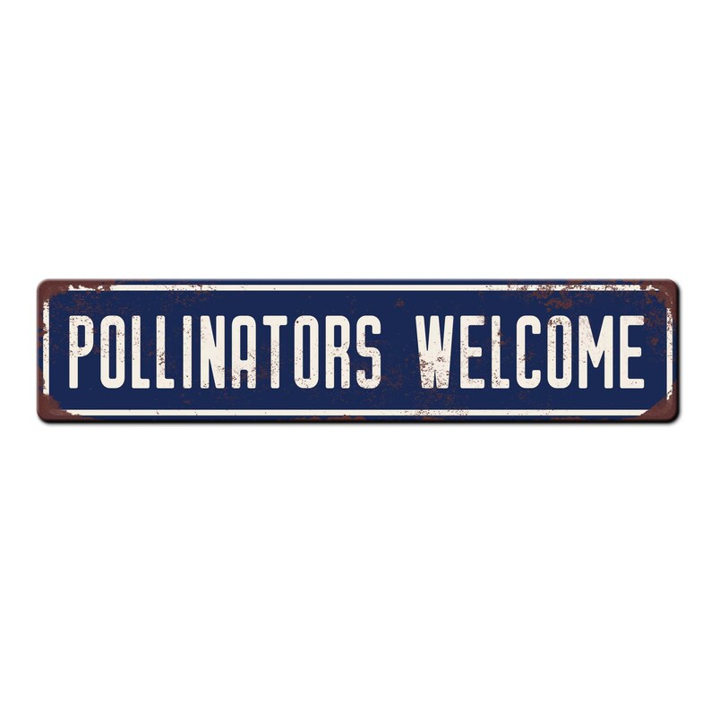 May include: A blue metal sign with white text that reads "Pollinators Welcome". The sign has a rustic, weathered look.