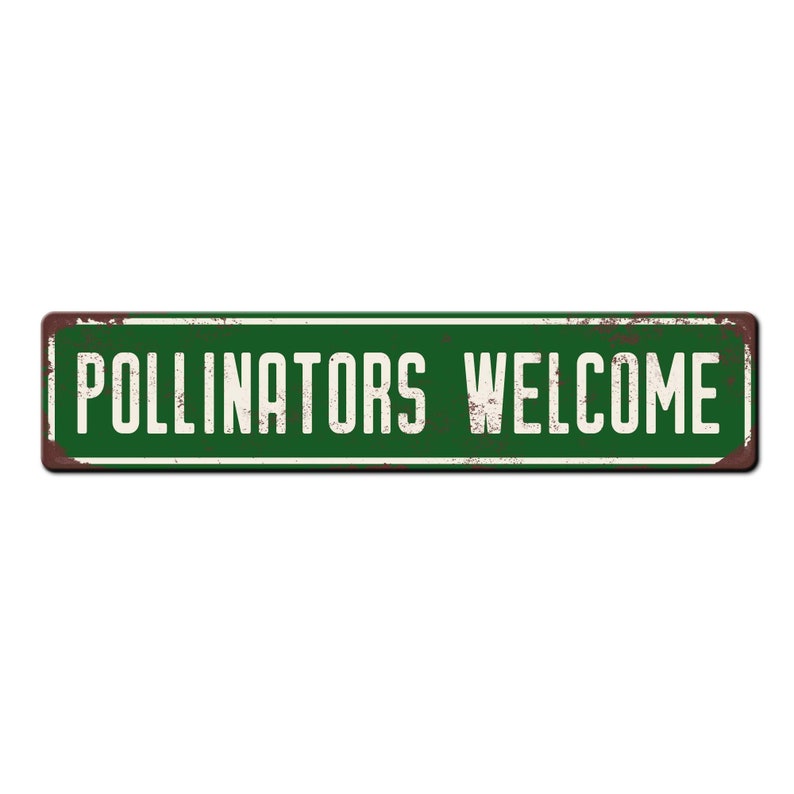May include: A green metal sign with white text that reads "Pollinators Welcome". The sign has a distressed, rusty look.