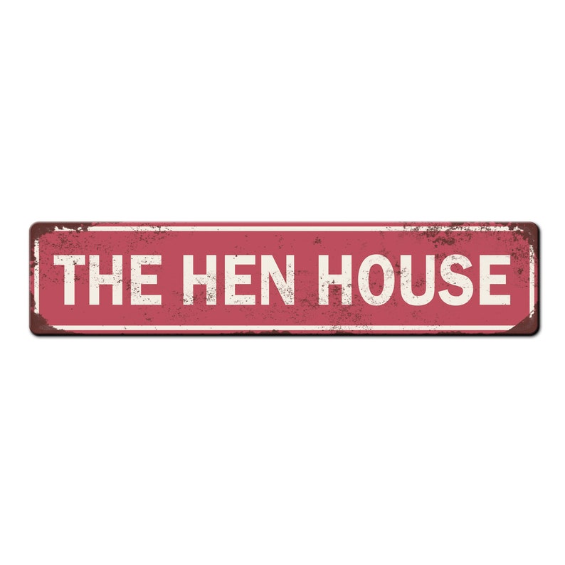 May include: A red metal sign with white text that reads "THE HEN HOUSE". The sign has a distressed, rusty look.
