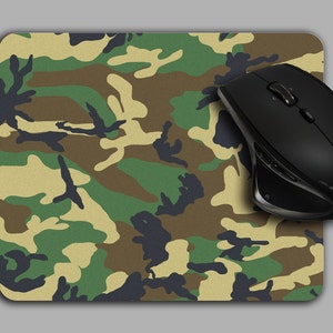 May include: A camouflage mouse pad with a black wireless mouse on top. The mouse has a blue logo that says "BlueFox".