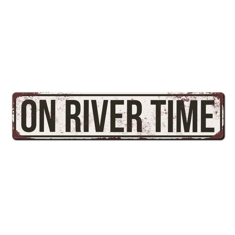 May include: A white metal sign with a distressed, rusty look. The sign reads "ON RIVER TIME" in black letters.