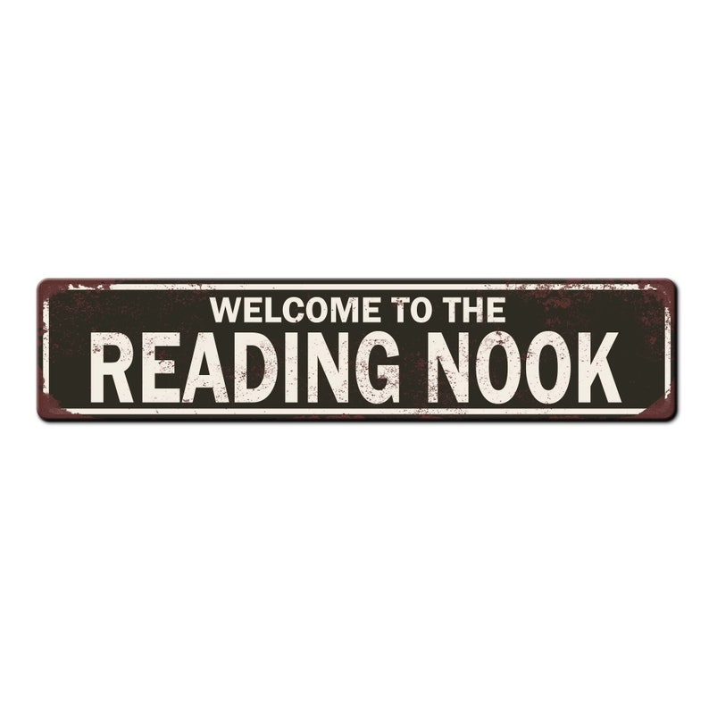 May include: A rusty metal sign with black background and white text that reads "Welcome to the Reading Nook".