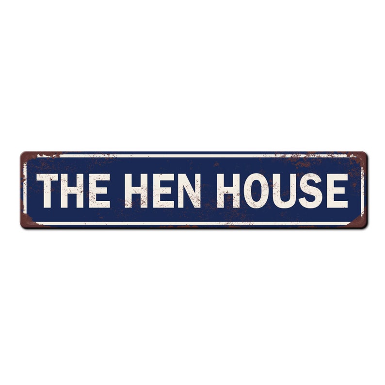 May include: A blue and white metal sign with the text "THE HEN HOUSE" in white lettering. The sign has a rustic, weathered look.