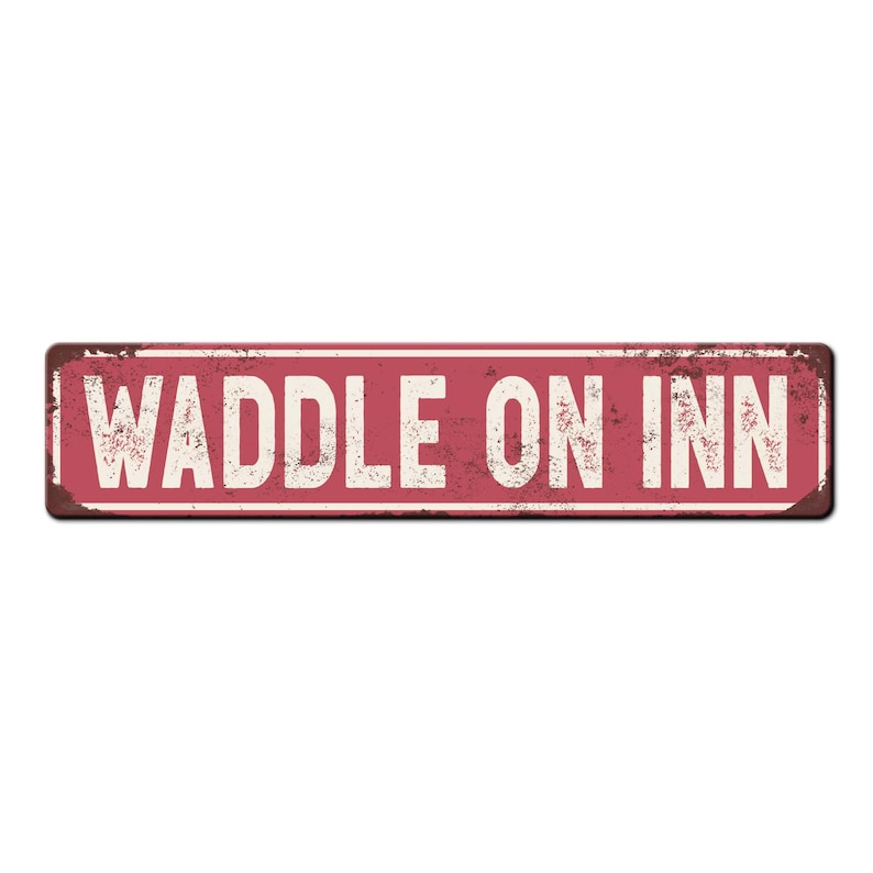 May include: A red metal sign with white lettering that reads "Waddle On Inn". The sign has a distressed, vintage look.