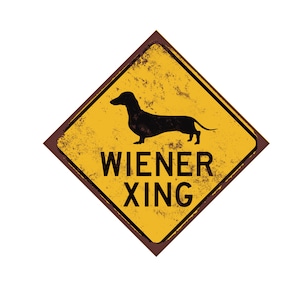 May include: A yellow and brown diamond-shaped sign with a black silhouette of a dachshund and the text "WIENER XING" in black.