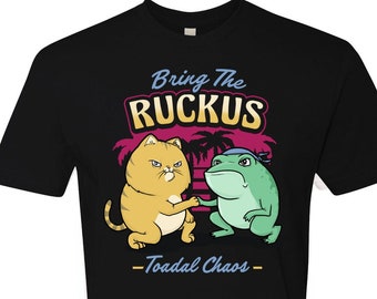 May include: Black t-shirt with a graphic of a cat and a frog shaking hands. The text "Bring the Ruckus - Toadal Chaos" is printed below the graphic.