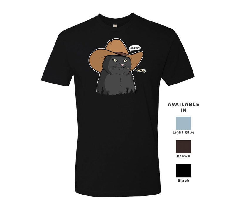 May include: Black cat wearing a brown cowboy hat with the word "MEOWDY" above it. The cat is looking to the right and has a small piece of straw in its mouth. The cat is on a black t-shirt.