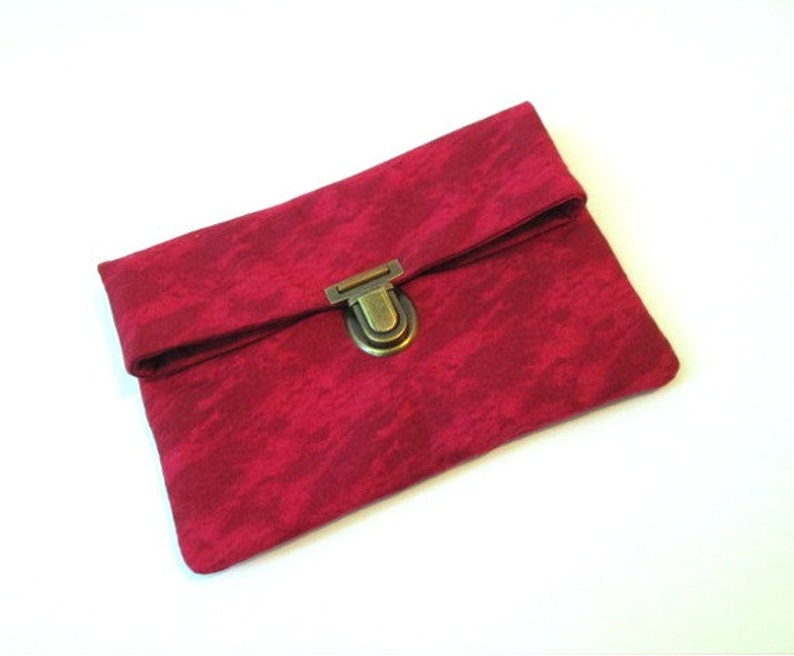 small red clutch bag