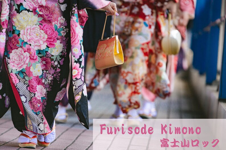 May include: A group of people wearing traditional Japanese Furisode Kimono with floral patterns. The kimonos are in shades of pink, red, and black. The people are walking down a street.