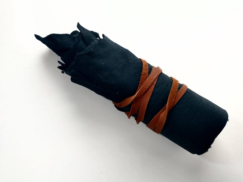 dark sheepskin with leather laces wrapped around it