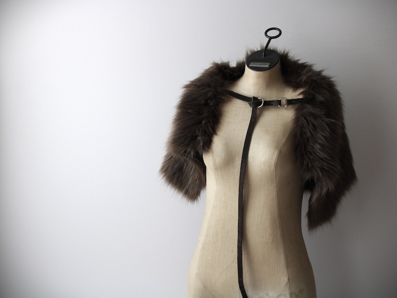 charcoal gray faux fur shoulder pelt with gray leather chest strap