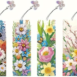 May include: Four colorful floral bookmarks with a butterfly charm. Each bookmark features a different floral design with a variety of flowers, including daisies, roses, and lilies.