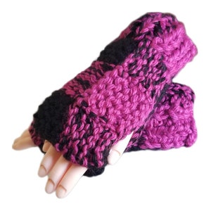 May include: Pink and black striped knitted fingerless gloves.