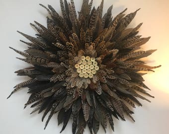 Pheasant feather wreath with gun cartridges