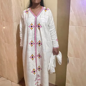 Rahwa Gabi dress with pink embroidery.
