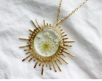 Soleil Heirloom — resin sunburst, bright shiny golden brushed brass pendant, chain pressed Queen Anne’s lace wildflower flower nashville