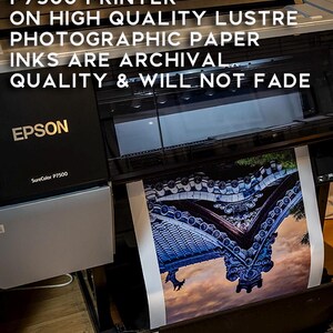 May include: An Epson SureColor P7500 printer is shown, printing a detailed image on high-quality lustre photographic paper. The text on the image states that the inks are archival quality and will not fade. The image being printed is of a detailed architectural structure.