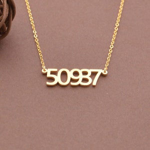 May include: A gold necklace with a pendant that says "50937".