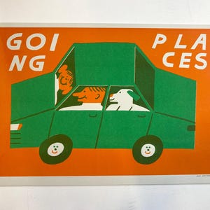 May include: A colourful illustration featuring a green car with the words "GOING PLACES" in white. The car contains two people and a dog. The background is orange. The wheels of the car have smiling faces.