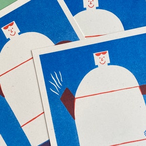 May include: Three blue and white cards with a red and white illustration of a person wearing sunglasses. The person is standing on a white background with a red line across the middle. The text "The" is visible at the bottom of the card.
