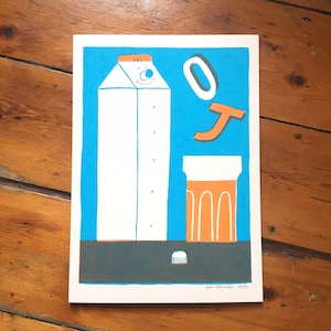 May include: A blue and white illustration of a milk carton with a face, a glass of orange juice, and the letters 