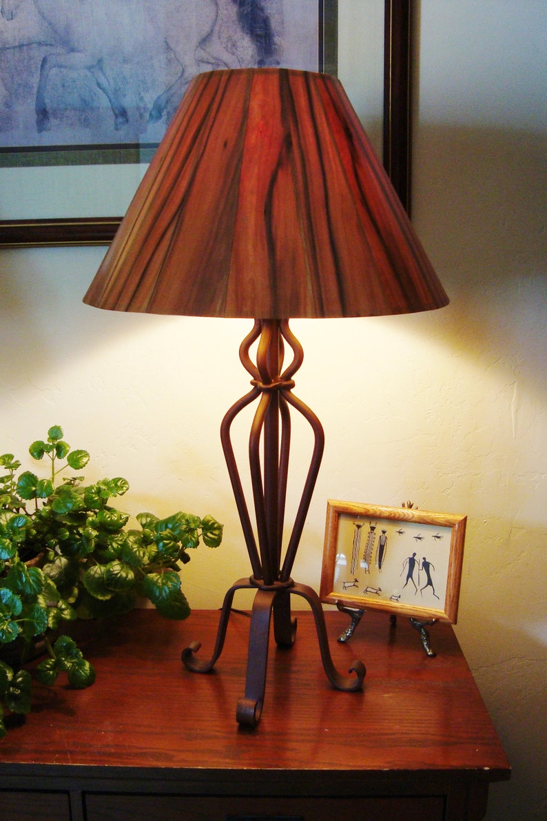 Red Gum Shade On Rust Colored Forged Iron Table Lamp