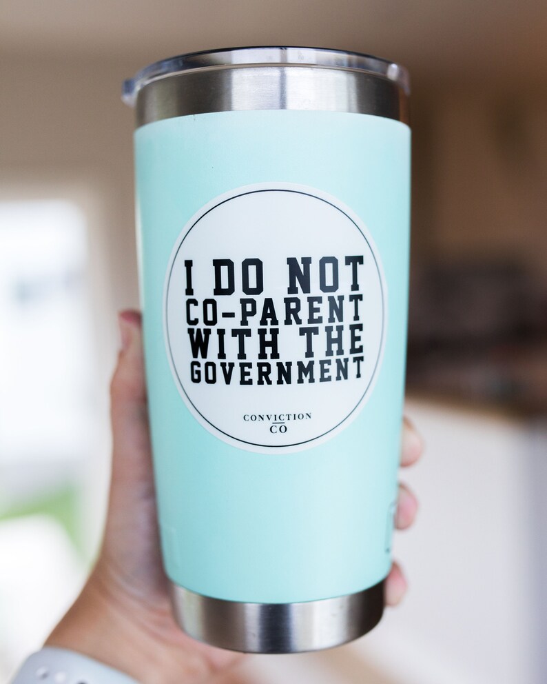 May include: A light blue stainless steel tumbler with a white sticker that says "I do not co-parent with the government" and "Conviction Co."