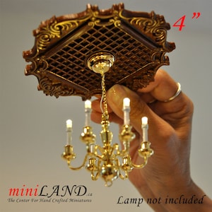 May include: A 4-inch dollhouse ceiling fixture with a decorative wooden frame and a gold chandelier with six candle-style bulbs.  Lamp not included.