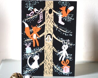 Christmas card pack with woodland animals in a tree