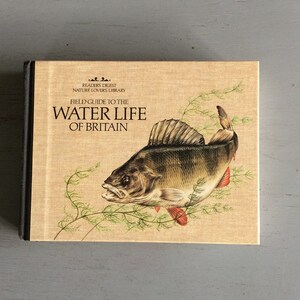 May include: A hardback book titled "Field Guide to the Water Life of Britain" from the Readers Digest Nature Lovers Library. The cover shows a detailed illustration of a fish and aquatic plants on a beige background.