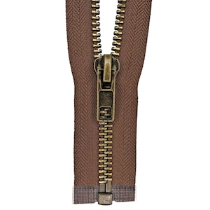 May include: Close-up of a brown zipper with a brass-colored pull and teeth. The zipper is centered against a white background. The fabric is a solid brown color.