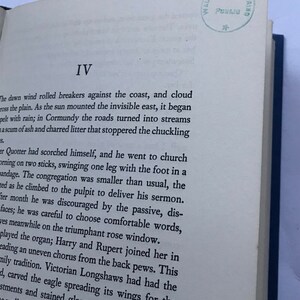 May include: A black and white printed page from a book with the Roman numeral IV at the top of the page. The text on the page describes a man who is injured and goes to church. The text is from a novel.
