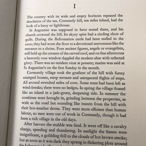 May include: A page from a book with text about the history of a village called Cormundy. The text describes the village's church, the surrounding countryside, and the people who lived there. The text is in a serif font and is printed in black ink on white paper.