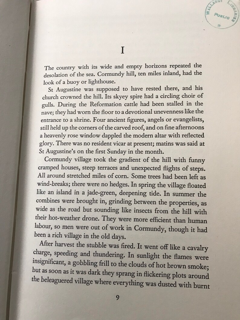 May include: A page from a book with text about the history of a village called Cormundy. The text describes the village's church, the surrounding countryside, and the people who lived there. The text is in a serif font and is printed in black ink on white paper.