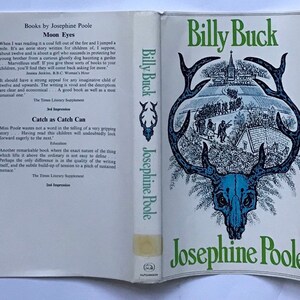 May include: A vintage book cover with a green and blue illustration of a deer skull with antlers. The book title is "Billy Buck" and the author is Josephine Poole.