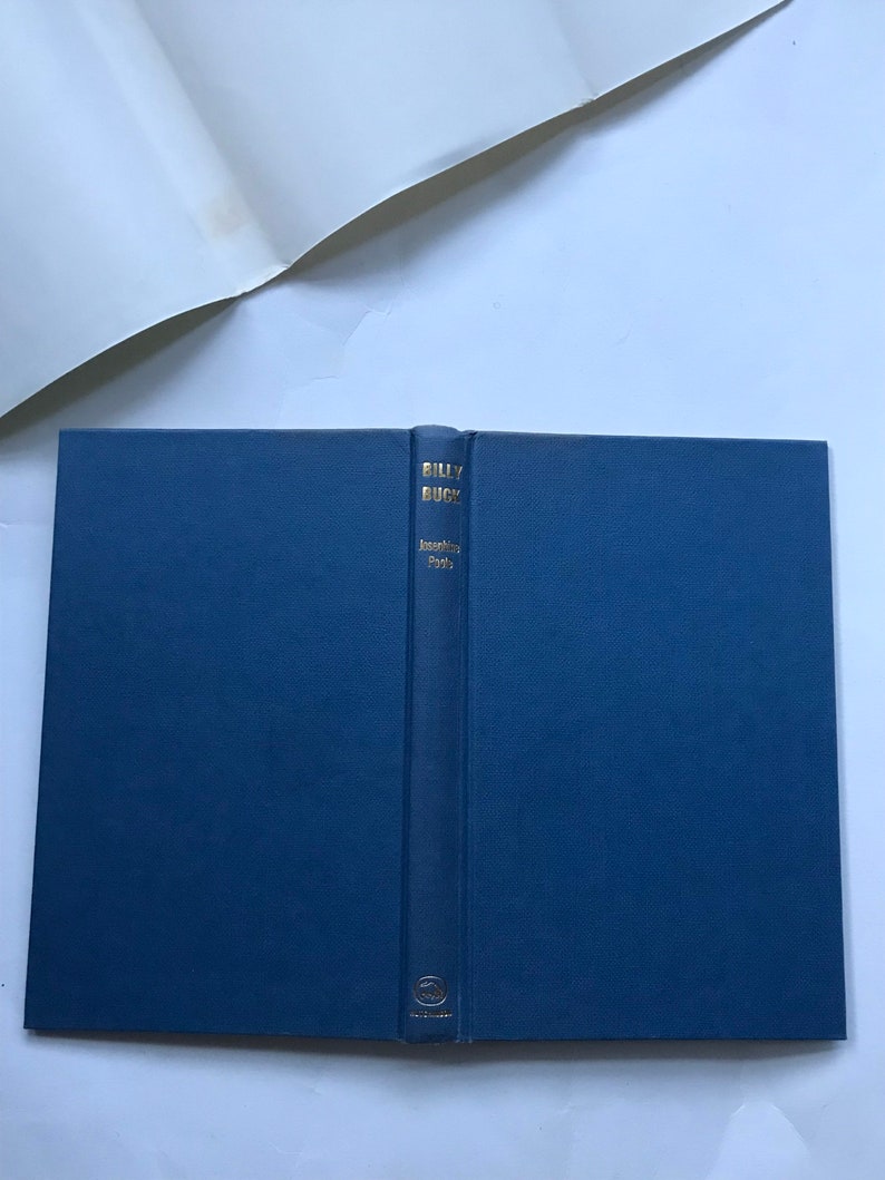 May include: A blue hardcover book with the title "Billy Buck" and the author "James A. Michener" printed in gold on the spine.