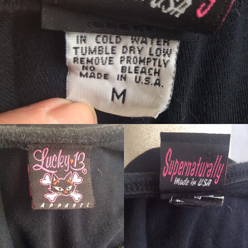 May include: Black Lucky 13 Apparel t-shirt with a skull and crossbones logo and a pink heart. The t-shirt has a care tag that reads "IN COLD WATER TUMBLE DRY LOW REMOVE PROMPTLY NO BLEACH MADE IN U.S.A." and a size tag that reads "M".