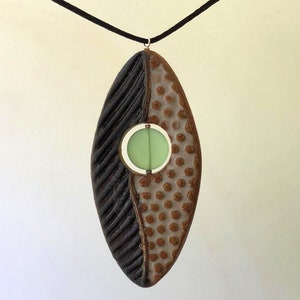 Black and White Pottery Pendant with sea glass accent bead