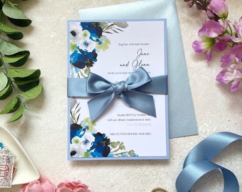 Dusty Blue Floral Wedding Invitation, with ribbon and envelope. Non-personalised sample