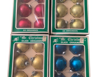4 Boxes of Mr. Christmas Glass Ornaments, green, gold, red, blue.
