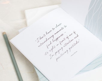 May include: A white card with a quote by Brene Brown that reads: "I don't have to chase extraordinary moments to find happiness - it's right in front of me if I'm paying attention and practicing gratitude."