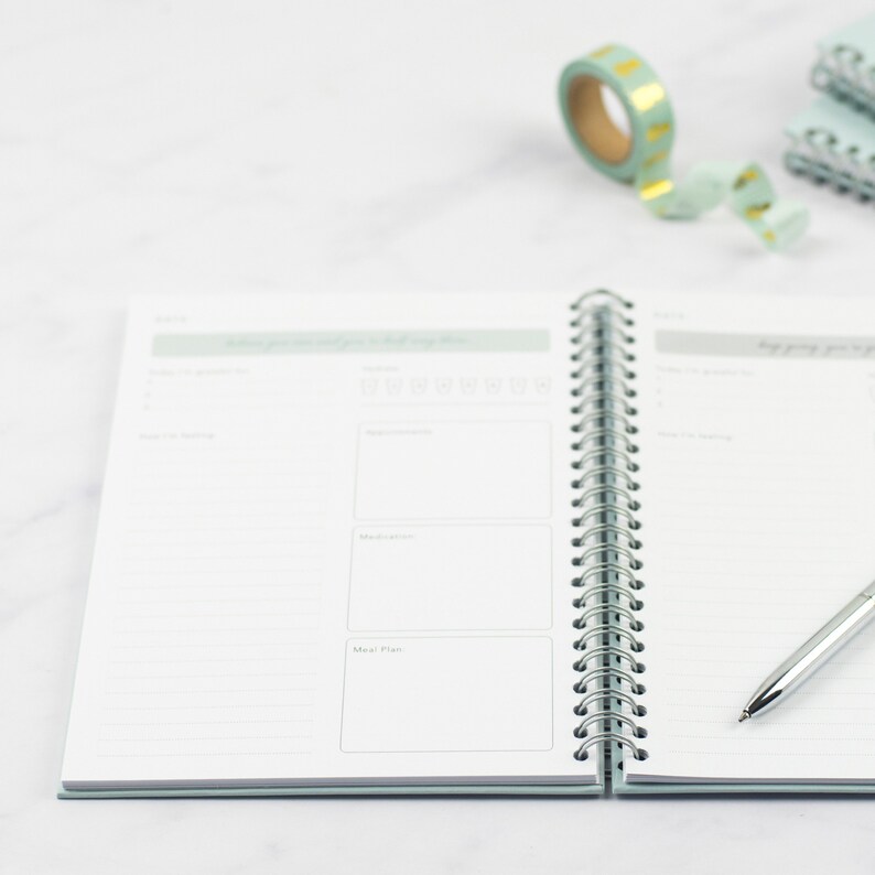 The ivf planner is wiro bound so it can open fully flat, the images shows the planner open and details the thickness of the front and back hardcovers.